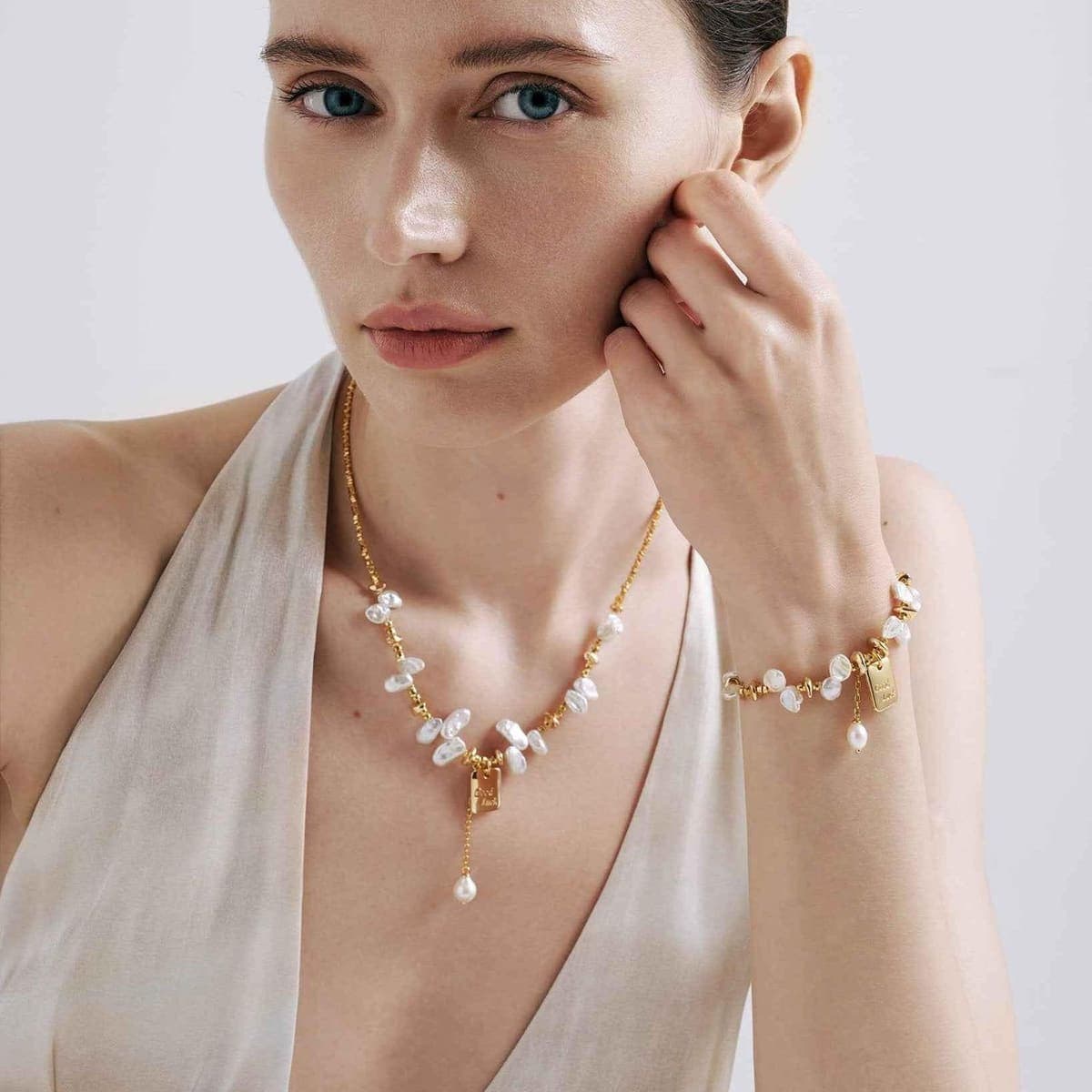 Keshi pearl necklace styled with an ivory dress