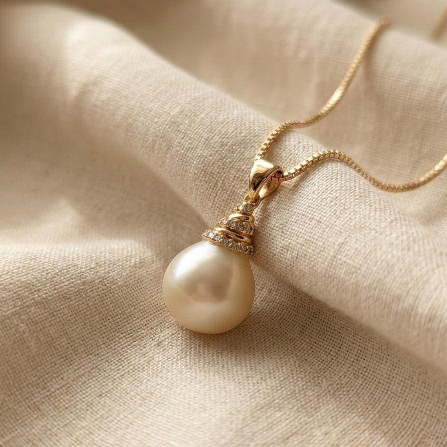 A teardrop-shaped pearl pendant